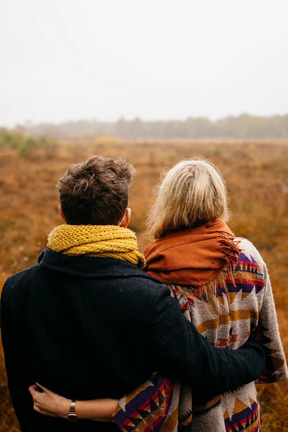 A couple gazing at a landscape vista