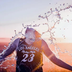 A figure being splashed with water