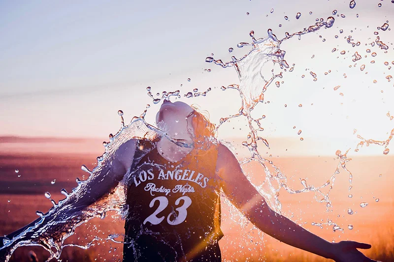 A figure being splashed with water