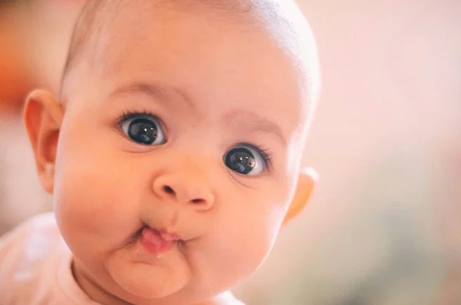 A baby with a funny expression